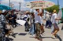 Locals march to protest the disappearance of foreign surfers in Ensenada, Mexico (Karen Castaneda/AP)