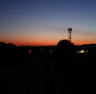 I took this picture stood on the Silk Mills bridge, looking down the great western main line as the sun sets. Ian Luxton
