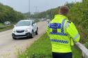Police officer monitoring speed on the A30