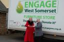 LIN Powis, left, receives her meal voucher for the Beach Hotel, Minehead, from Engage’s chairman of trustees, Sue Eley, after donating the 10,000th item of furniture to the charity’s furniture re-use project.