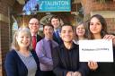 COLLEAGUES: Staff at the Taunton Visitor Centre with Chloe Main and Timothy Fiore, front right and second from right