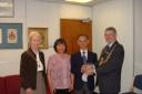 Taunton Deane Mayor Cllr Chris Hindley presenting a citizenship award to Chu Lam.