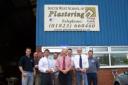 Paul Robottom meeting students at South West School of Plastering, Bob Weekes, head of centre, Geoff Weekes, the company's business consultant and Andy Ware, instructor and assessor.