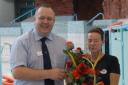 Paul Morgan presents the roses to Debbie Griffiths.
