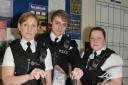 Officers at Bridgwater police station with some of the confiscated knives, drugs and money