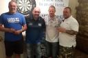 FINALISTS: Frank Woodard, Mark Stock, Leighton Cox and Adie Haines finished in the top four and, right, overall winner Mark Stock takes to the oche