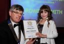 Rowena is pictured receiving her certificate from Don Heys, president of the Rotary Club of Taunton