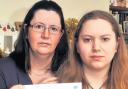 Katherine Langford, right, and her mum, Caroline, with the letter of condolence.. Picture: County Gazette