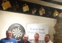 FINALISTS: Frank Woodard, Mark Stock, Leighton Cox and Adie Haines finished in the top four and, right, overall winner Mark Stock takes to the oche