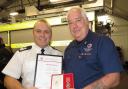 AWARDED: Long-serving firefighter Richard Solomon, right, with Somerset Fire Service Chief Fire Officer  Glen Askew when he was presented with a 40-year service award