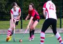 TUSSLE: Jodie Baker (left) in action for Taunton Civil Service 2nds. Pic: Steve Richardson