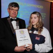 Olivia collects her award from Don Heys, president of Taunton Rotary Club