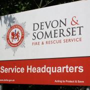Devon and Somerset Fire Team help an injured lady on the cliff.