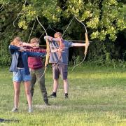 Explorers having a go at archery. Picture: Nigel Taylor