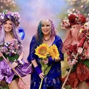 Three Wishes Fairy Festival Founder Karen Kay with two flower fairy escorts.