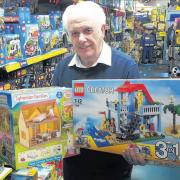 Mike Slocombe, of Watkin’s in East Reach, Taunton, with two of this year’s top ten toy ranges.