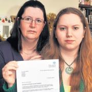 Katherine Langford, right, and her mum, Caroline, with the letter of condolence.. Picture: County Gazette