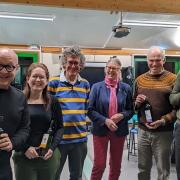 The winning team from left to right are: Michael Butcher (1st Horn player), Jodie Watson  (Soprano Cornet player & chairman), Kevin the quizmaster, Mary Rhodes (Twinning Society Chairman), Mark Tranter (Flugel Horn player) and Niall Watson (Band M.D.)