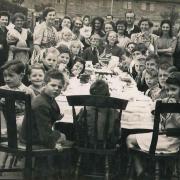Children celebrating in a street party in Taunton in 1945.