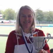 SILVERWARE: Carol Matravers from Minehead Hockey Club, with her medal and the cup.