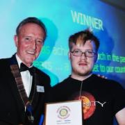 Alex Cook collecting his award at last year’s ceremony from Tony Murray, or Rotary International