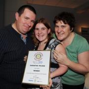 Samantha is pictured with proud parents Nick and Alison Tolson. PHOTO: Geoff Hall