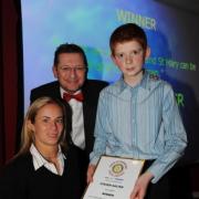Steven Salter is pictured receiving his award from Lucy Shuker and Ken Bird. PHOTO: Geoff Hall