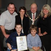Mathew is pictured, front left, at the awards with Mason and parents with Cllr Alan Gloak