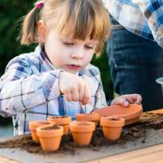 PLANTING: A child with flowerpots. Picture: Thinkstock/ PA