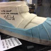 MOON WALK: A replica moon boot signed by the Apollo-16 astronaut Charlie Duke. Picture SWNS