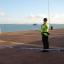 A police officer stands guard near the spot where a torso wrapped in a bin liner was found on a popular tourist beach at Southsea, Hampshire