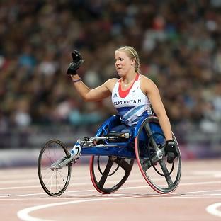 Hannah Cockroft celebrates winning gold in the Women's 100m T34 Final at the Olympic Stadium, London