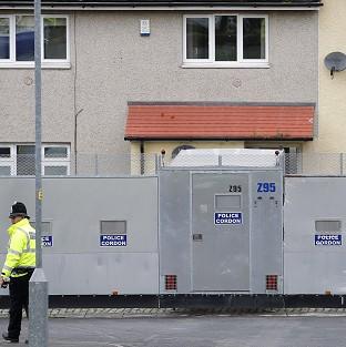 Police forensic officers continue to work at the scene of the shooting of Pcs Fiona Bone and Nicola Hughes in Hattersley, Greater Manchester