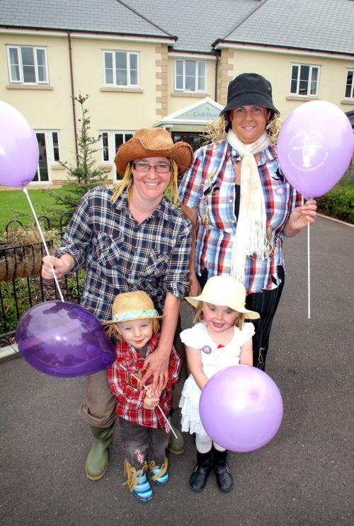 Marie Ellis and Sharon Hudson, with Peter Ellis, two, and Amy Burnett, three. PHOTO: Steve Guscott