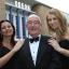 SMITH, STAN SMITH: Flanked by ‘Bond girls’ Amy Dorgan and Kate Paszkowec at the Odeon.