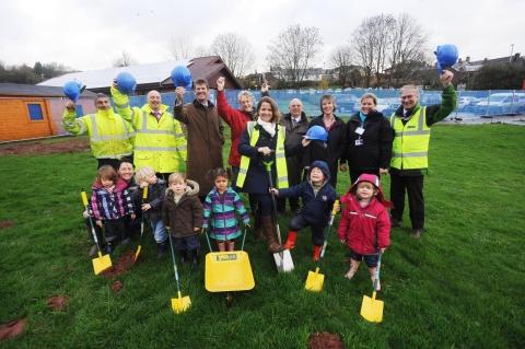 The turf cutting at the site of the new Lister House Surgery with Dr Sarah Burford performing the cut, helped by children from the Paddocks Nursery at Wiveliscombe Children's Centre.