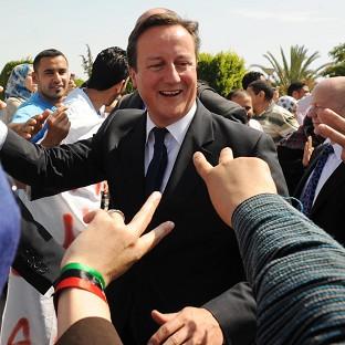 Prime Minister David Cameron told police recruits it was 'very good to be back' in Libya