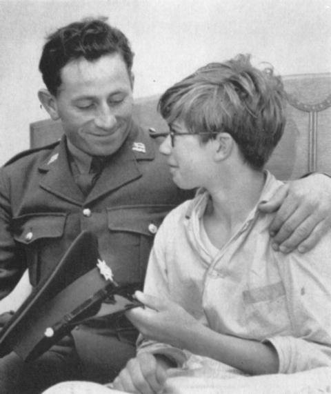 Cpl Geoffrey Booth with Michael Webber, the 14-year-old boy he rescued in 1964. PHOTO: The Green Tiger