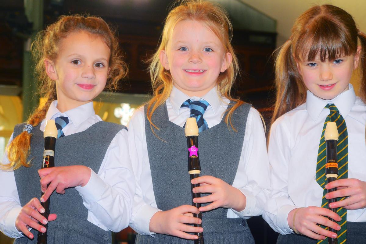 Freyja Shaw and Ellie Knight from Wellington Prep School with Lauren Jackson from Trull School, competing for the Junior Solo Recorder Cup