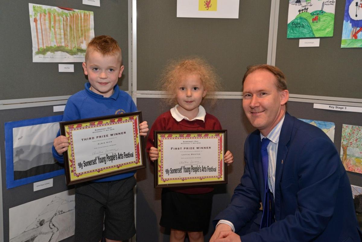 EARLY YEARS ART WINNERS: Albie Rice and Lottie Weston with Somerset County Council leader John Osman