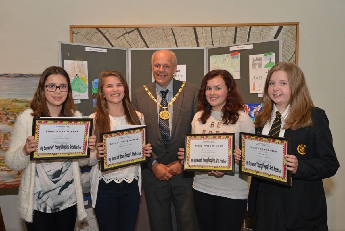 KEY STAGE 3 ART WINNERS: Amy Hart, Jemimah Dicker, Chloe Rogers and Caitlin Job with Sedgemoor District Council chairman Ian Dyer