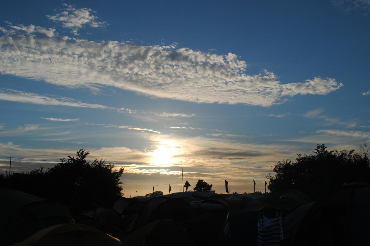 Pictures from the Glastonbury Festival 2016 at Worthy Farm, Pilton, Somerset. A campsite view at sunset.