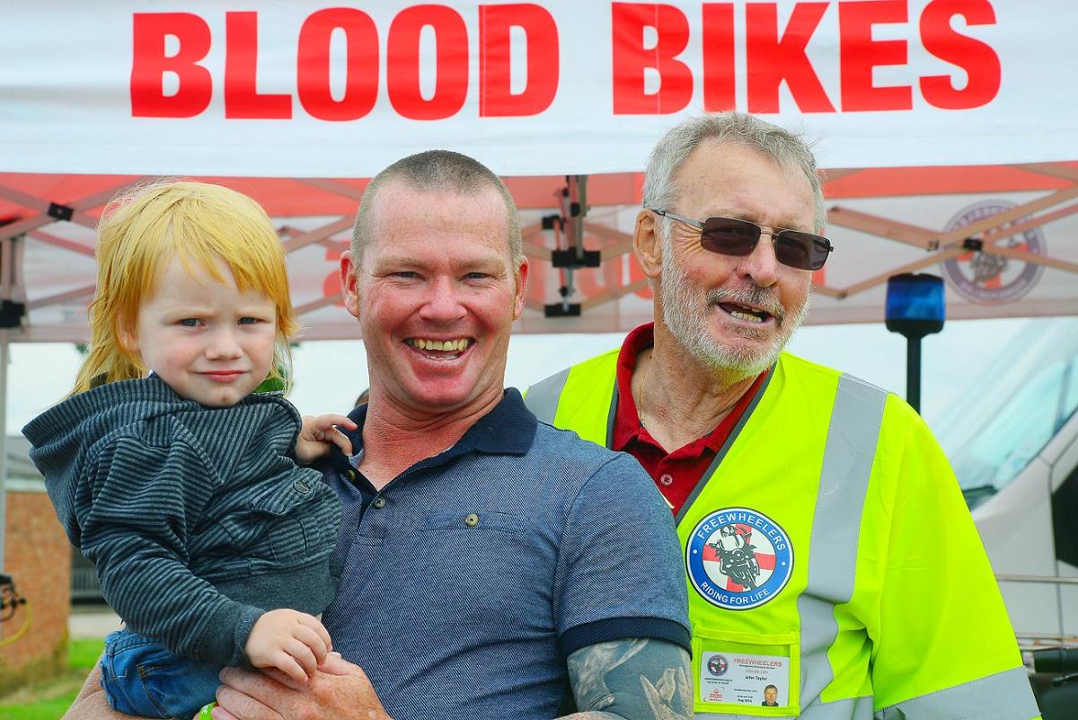 Xander and Paul Lawrence with John Taylor from Freewheelers Blood Bikes