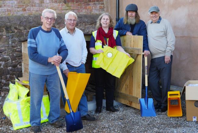 EQUIPMENT: Nicola Dawson of CRISP (centre) with Dunster Parish Council Flood Group members Geoff Witherford, Alan Vicary, Alan Rigler and Doug Challoner