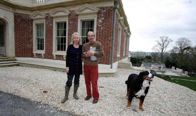 File photo of Esmond Bulmer with his wife Susie and dog Echo outside their home 