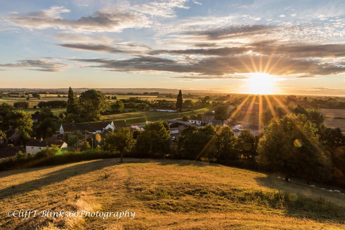 The setting sun from Burrow Mump, by Cliff Taylor