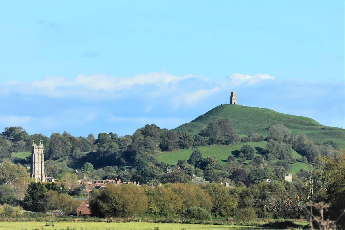 Glastonbury Tor with the towers of St John's and St Benedict's in the foreground, by Andy Linthorne