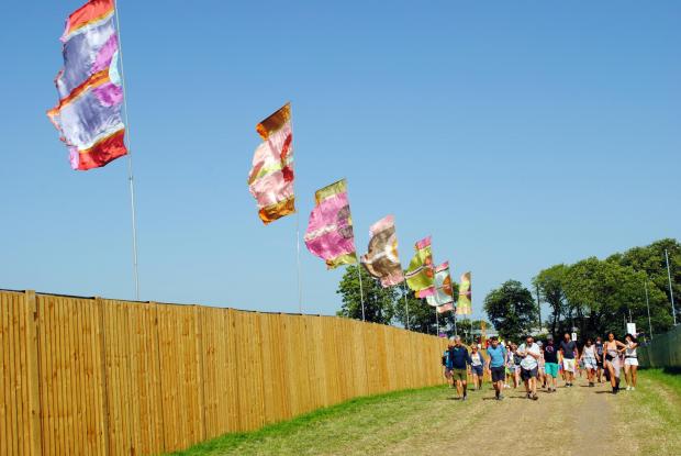 Somerset County Gazette: Fans enter Glastonbury Festival in 2019. Picture: Paul Jones