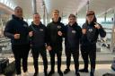 DEPARTURE: Taunton boxer Pawel August (pictured centre) and his team heading to Poland