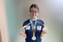 Caroline Faithful with her medals.
